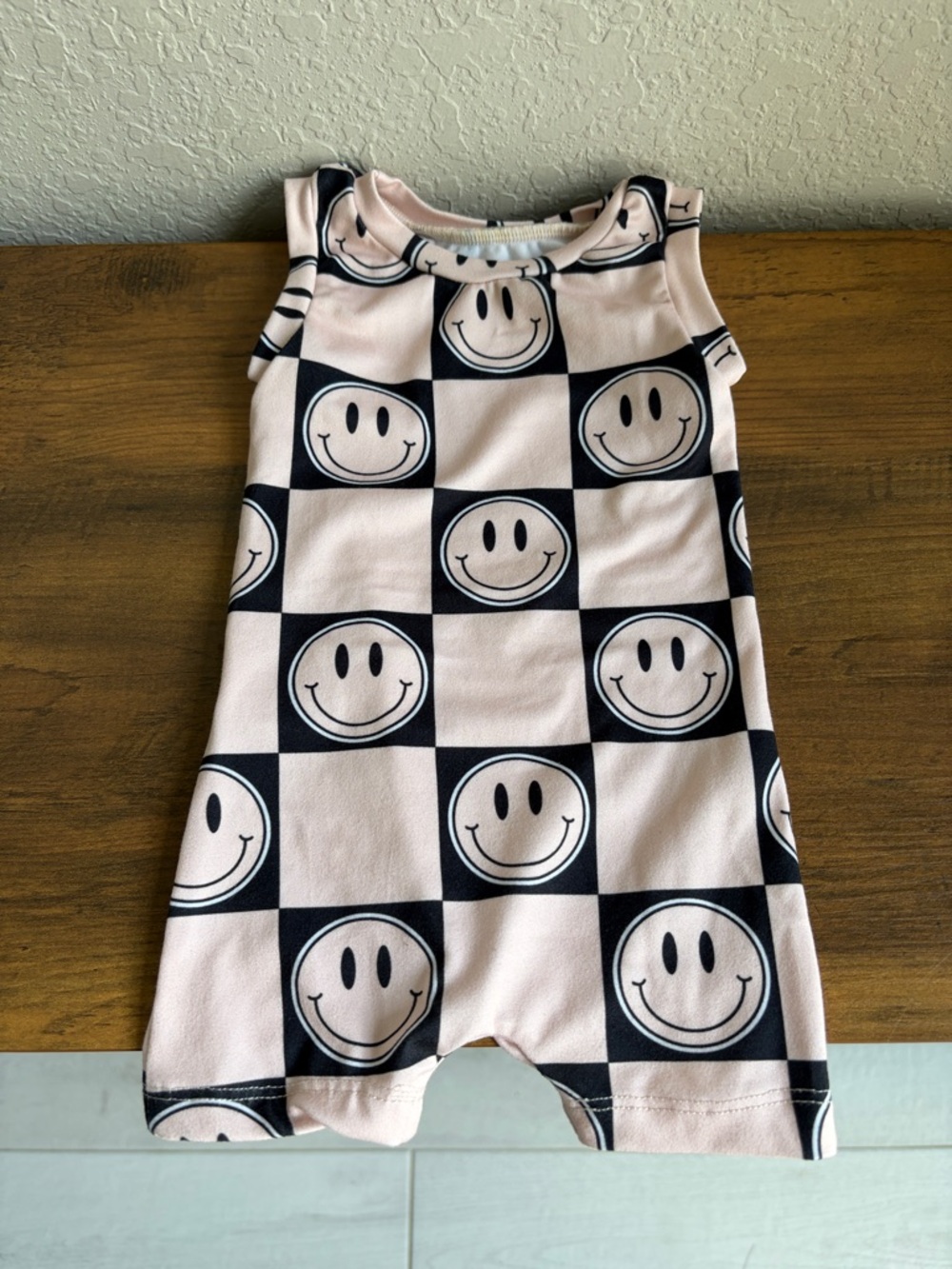 Smiley Face Checkerboard Baby Romper in Light Pink and Black